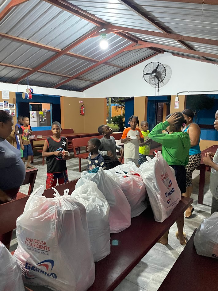 Picture of the Baseball WIthout Borders group supporting Casa Amor in the Dominican Republic with a holiday party for all the children.