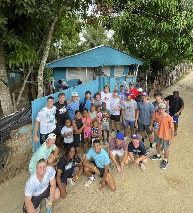 Volunteers paint houses in small villages in the Dominican Republic.