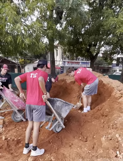 Picture of baseball players supporting Baseball Without Borders by renovating a field in the Dominican Republic. 