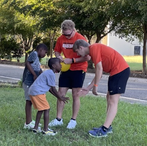 Baseball Without Borders volunteers playing with children at the NPH orphanage in the Dominican Republic.